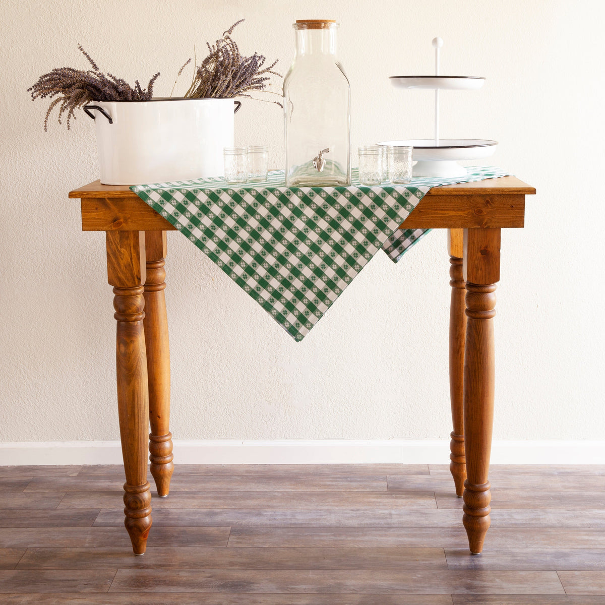 Rustic farm cocktail table with linen check tablecloth and vintage enamel tableware